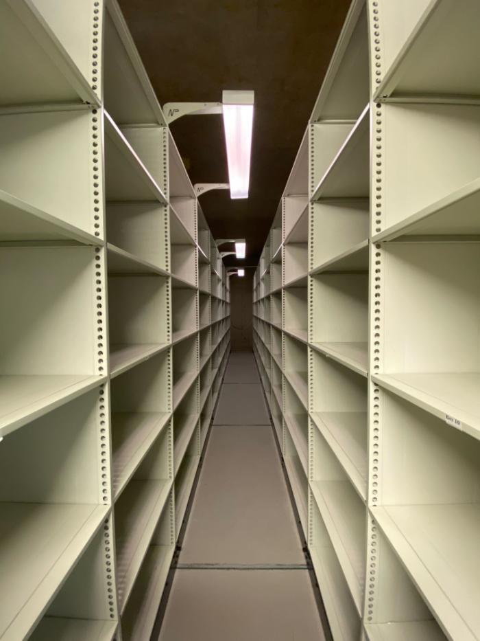 A newly empty aisle in the strongroom, ready for new accessions!