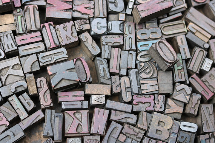 An assortment of typeset letter printing blocks