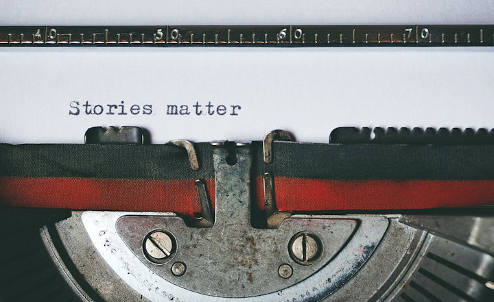 An old typewriter with the typed words 'stories matter'