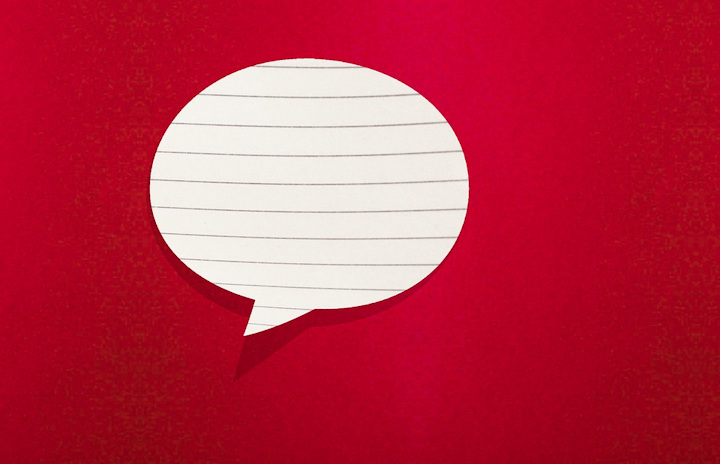 A speech bubble of lined paper on a red background