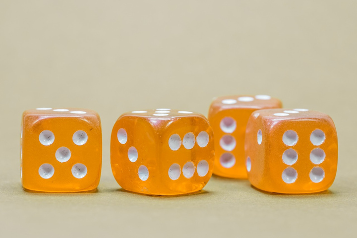 Four yellow dice