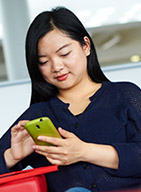 A student using a mobile phone.