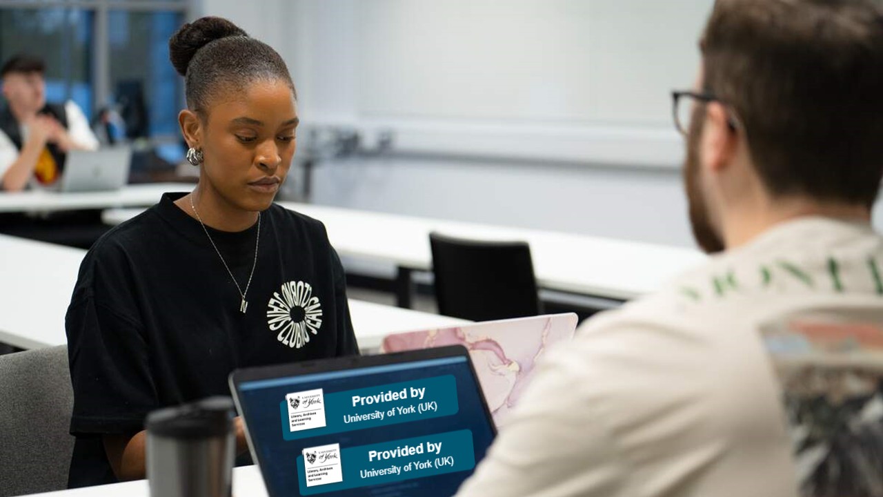 A student with a laptop which has the LibKey Nomad button on the screen