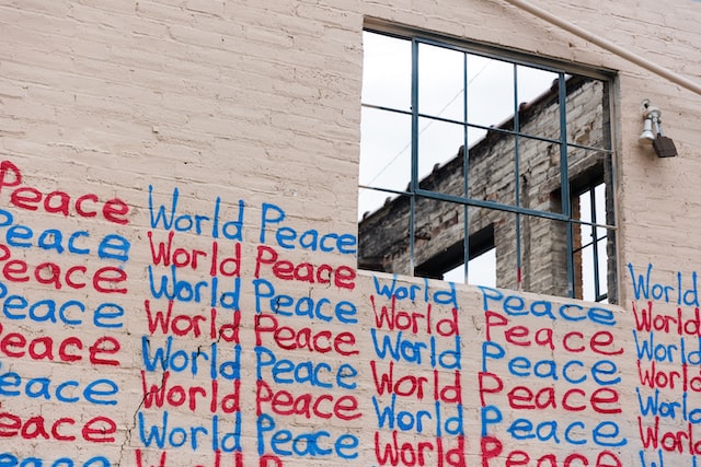 building with words World Peace written on it in graffiti