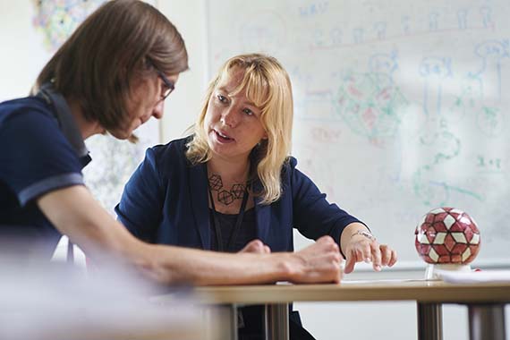 Professor Reidun Twarock supervising a student